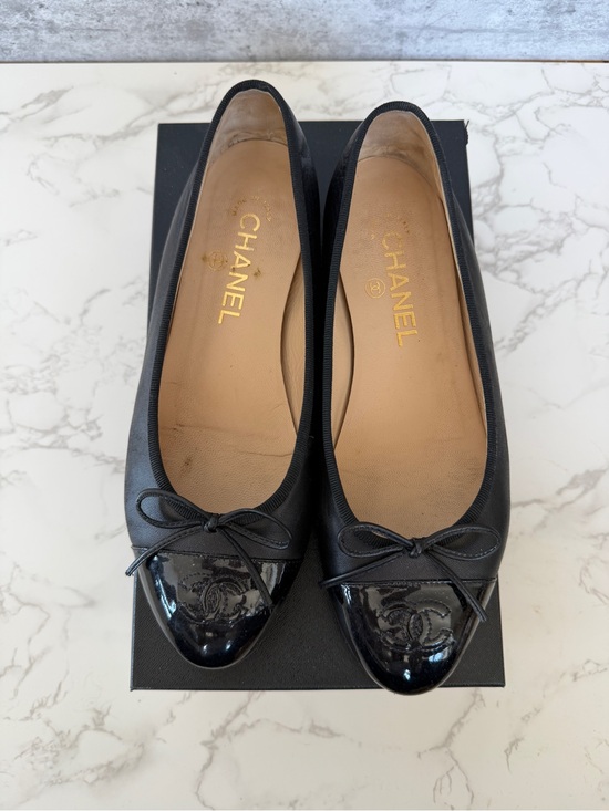 CHANEL Shoes - CHANEL Black Leather Cap-Toe Ballet Flats with Patent Toe